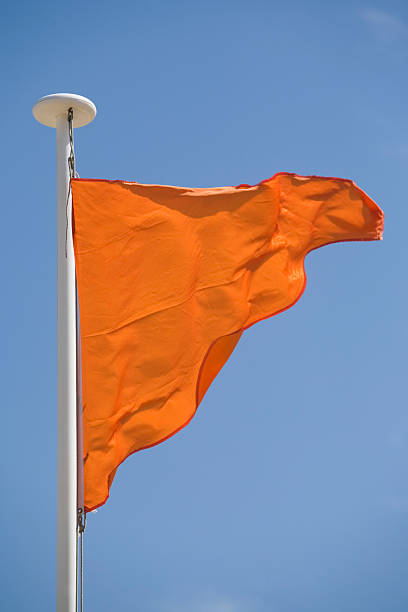 istock orange flag meaning that bathing is dangerous but watched 117292130