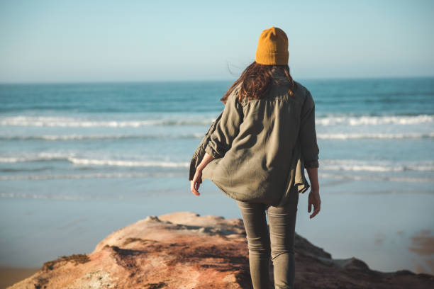 istock Beautiful woman on the beach 1172923214