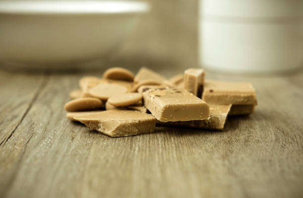 istock Gold chocolate on a wooden surface 1172926177