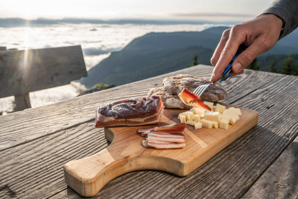 istock Snack with delicious South Tyrolean smoked bacon and cheese with flatbread  lying on a rustic table 1172927525