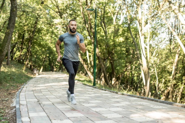 istock Man running in nature 1172928380