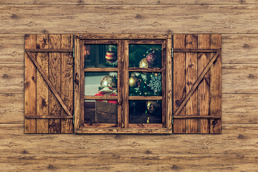 view of wooden facade with Window showing Christmas motifs