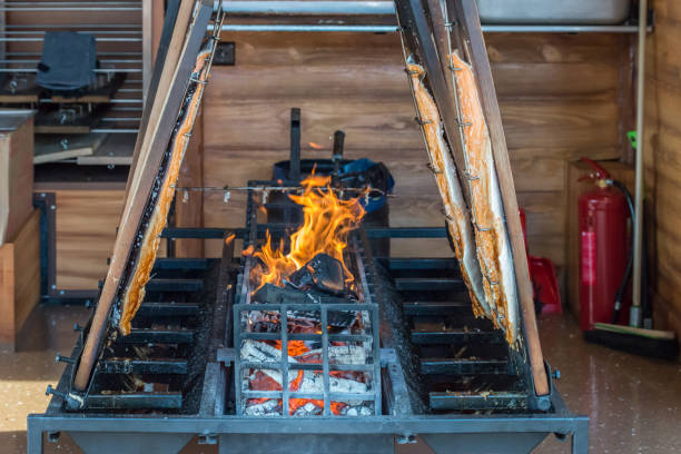 istock Freshly grilled stockfish on open fire and glowing charcoal, Germany 1172936578
