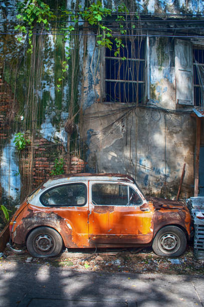 istock Old vintage orange car in the old community. 1172937377