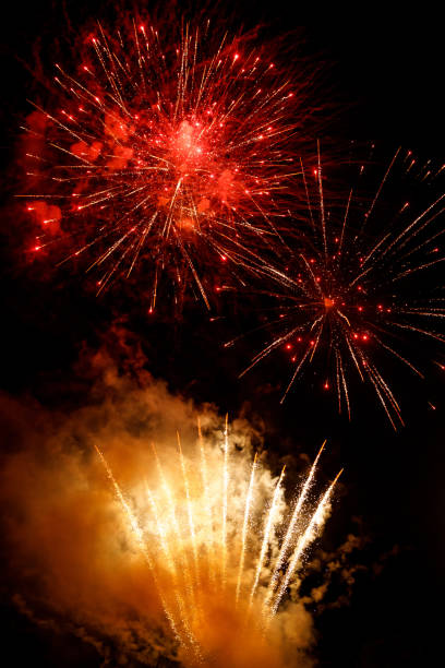 istock Close-up red and gold festive fireworks on a black background. 1172939993