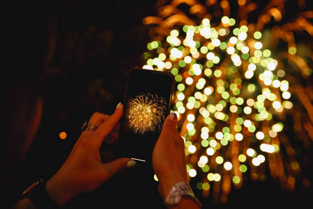 istock shoots fireworks video on smartphone. 1172940957