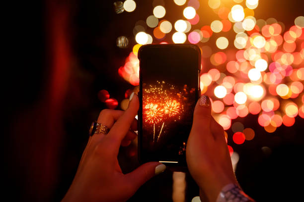 istock shoots fireworks video on smartphone. 1172940960