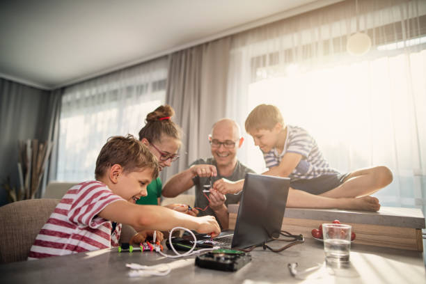 Father and kids enjoying coding and electronics at home Kids doing computer science project at home. Father is helping them in assembly and programming miniature electronic devices.
Nikon D850 school science project stock pictures, royalty-free photos & images