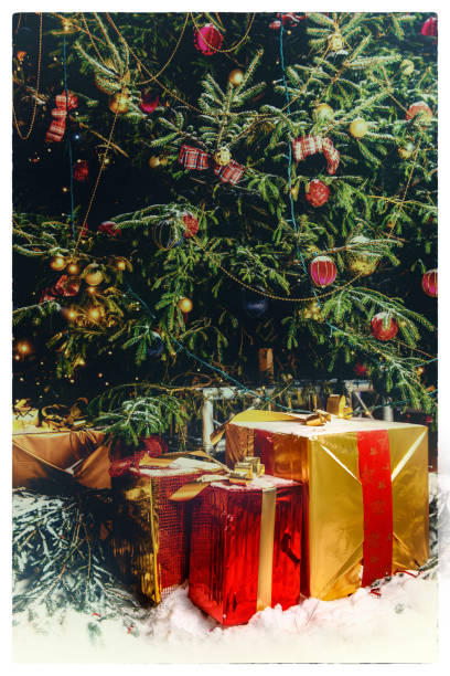 istock Beautiful decorated christmas tree with present boxes in a winter concept 1172941656