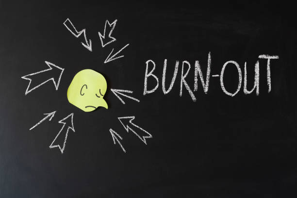 istock smiley with bad mood and inscription burn out on a chalkboard 1172942755
