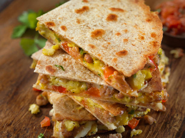istock Cheesy Breakfast Quesadilla with Sausage, Scrambled Eggs and Peppers 1172945123