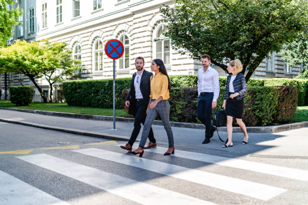 istock Business people walking on pedestrian crossing 1172945168