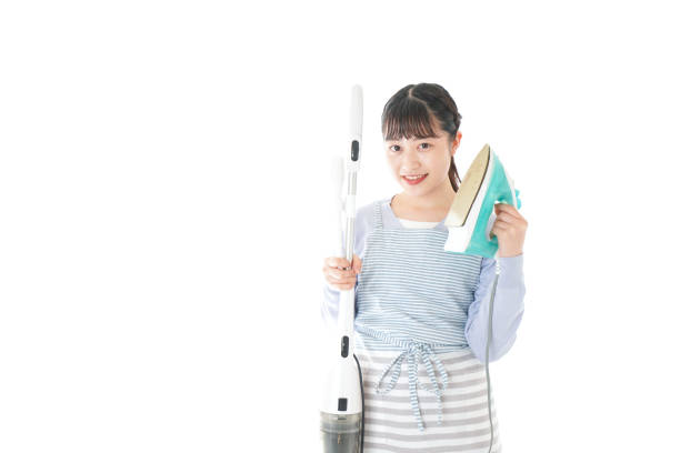 istock Young housewife doing housework with smile 1172946100