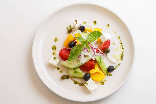 istock greek salad on white background 1172946223