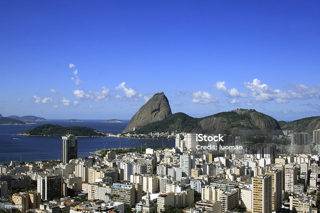 Sugarloaf Mountain in Rio de Janeiro Flamengo district in the foreground Bay of Water Stock Photo