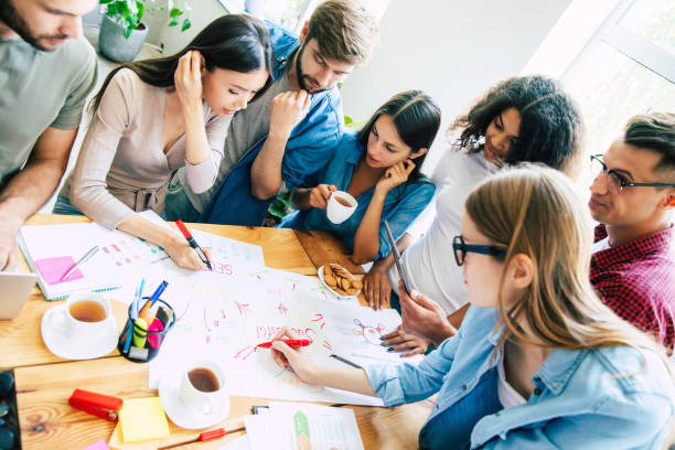 istock Brainstorming in start up office. Modern young cheerful business team is working on an important project 1172947364