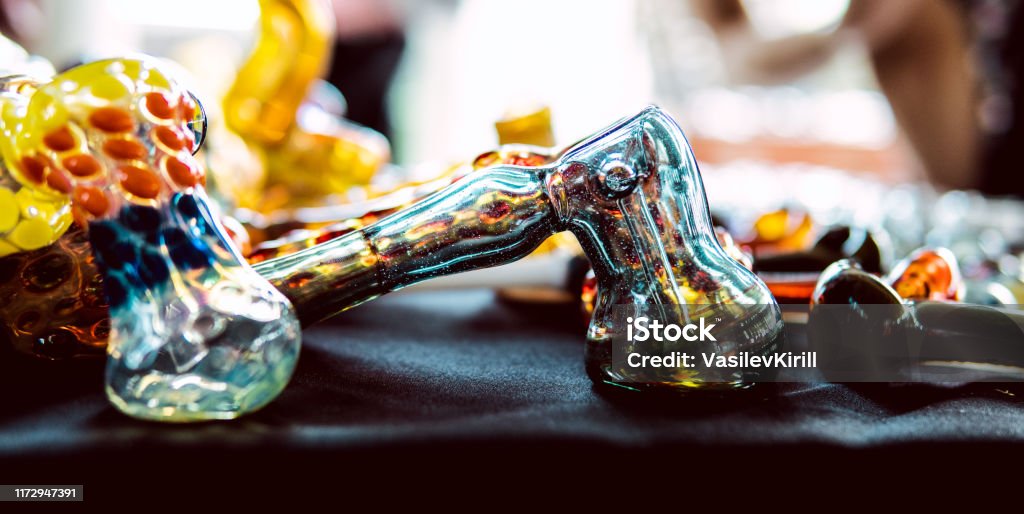 Accessories for smoking marijuana in the store. Smoke culture in 2020 Bong Stock Photo