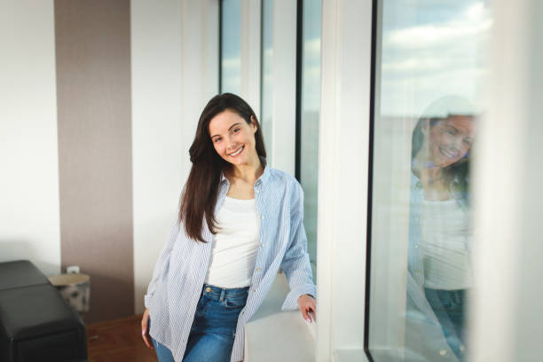 istock Woman near window 1172947552