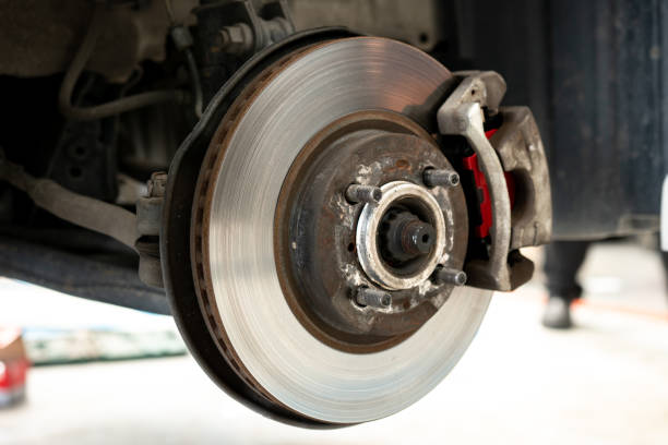 istock Car disc brake repair service performed maintenance and replacement brake pad. 1172947685