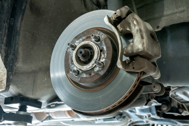 istock Car disc brake repair service performed maintenance and replacement brake pad. 1172947692