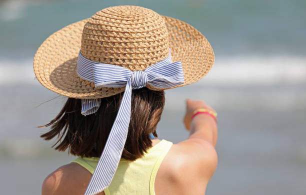 istock little girl with straw hat in summer 1172949335