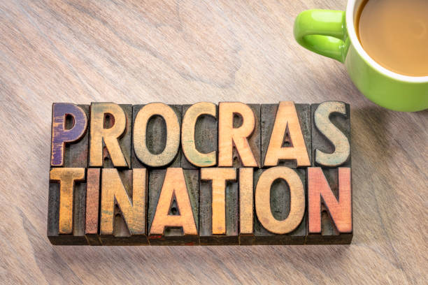 istock procrastination word abstract in wood type 1172949371