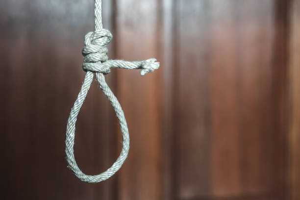 commit suicide concept, Hangman's noose knot hang from the ceiling commit suicide concept, Hangman's noose knot hang from the ceiling silhouette of the hanging noose stock pictures, royalty-free photos & images