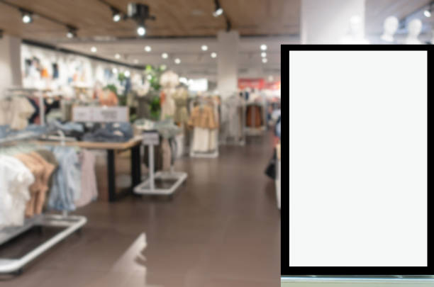 istock advertising light box or blank showcase billboard for your text message or media content with blurred image popular women fashion clothes shop showcase in shopping mall, commercial, marketing concept 1172954435