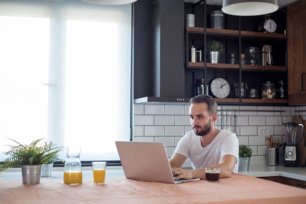 istock Focused young man working on small business start up with a laptop. 1172955779