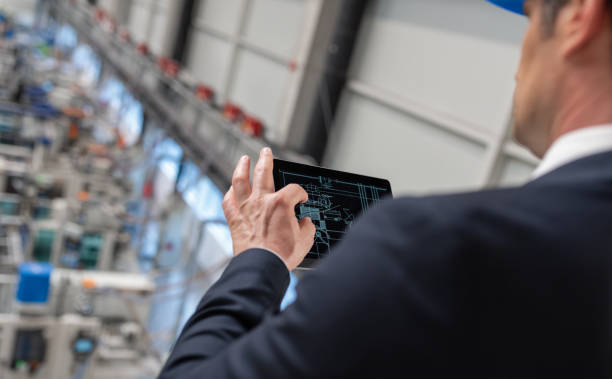 istock Businessman Using Digital Tablet In A Factory 1172957404