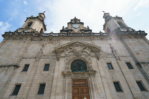 Exterior baroque architecture in Bilbo in Basque country. San Nikolas Eliza church photography in summer sunny day.