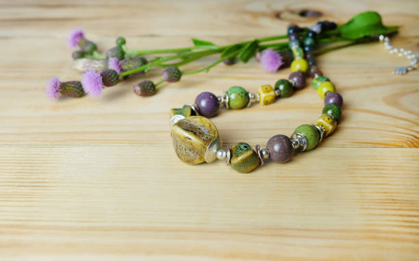 istock Beads from ceramics and natural stones and thistle flowers 1172960661