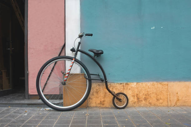 istock Penny Farthing bicycle, mountain model leaning on a blue wall. Penny Farthing current model 1172960800
