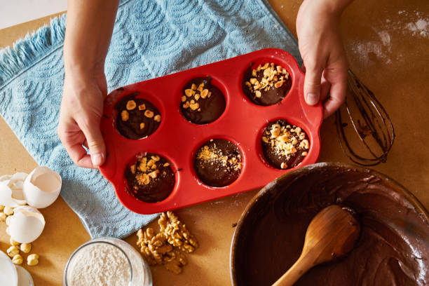 istock Mother and children preparing cake together 1172962009