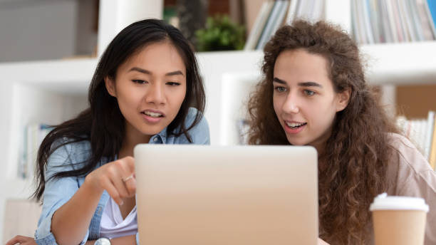 istock Horizontal photo young diverse students colleagues using laptop together 1172962536