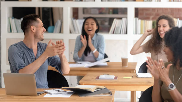 istock Horizontal photo diverse students group applauding, celebrating success 1172962572