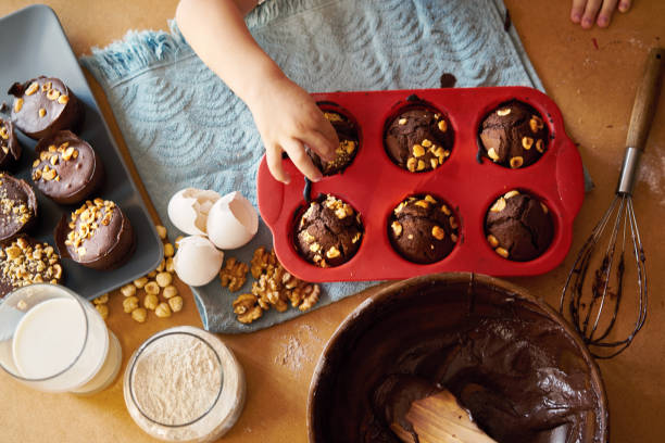 Mother and children preparing cake together