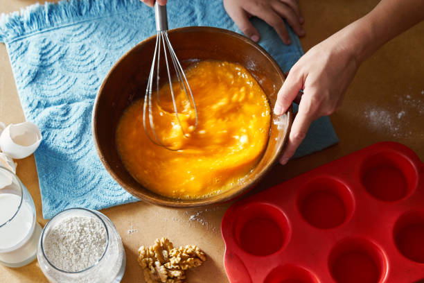 istock Mother and children preparing cake together 1172962580