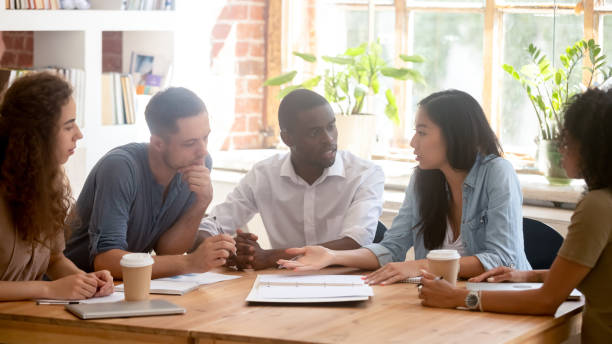 istock Horizontal photo diverse employees team discussing project at meeting 1172962615