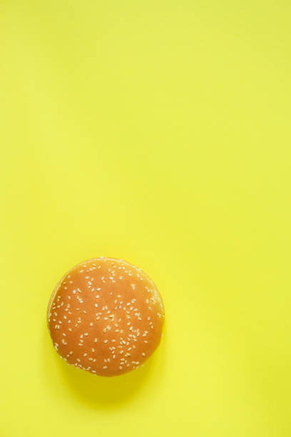 istock burger bun (wheat sesame seed bun) menu concept. food background. copy save. Top view 1172963307