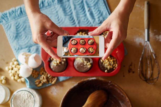 istock Woman taking cake photo for sharing 1172963569
