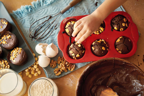 istock Mother and children preparing cake together 1172963817