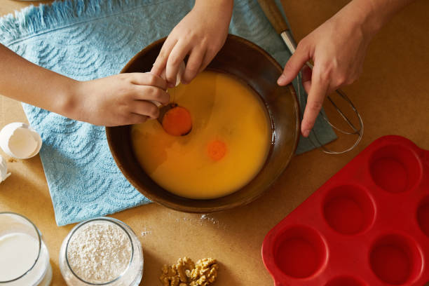 istock Mother and children preparing cake together 1172963933
