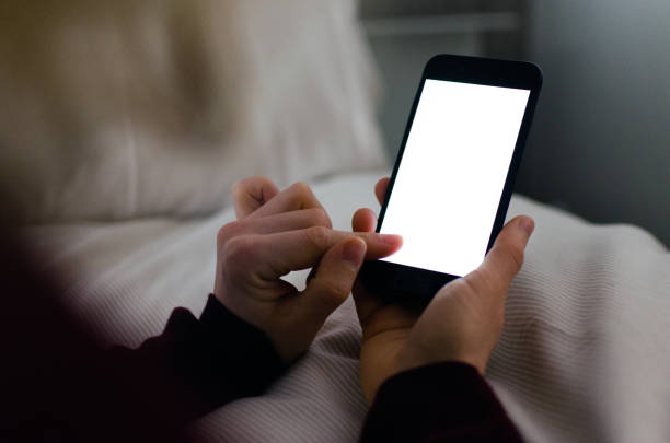Lit smartphone with blank screen and copy space stock photo