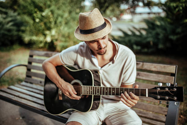 Musician playing acoustic guitar