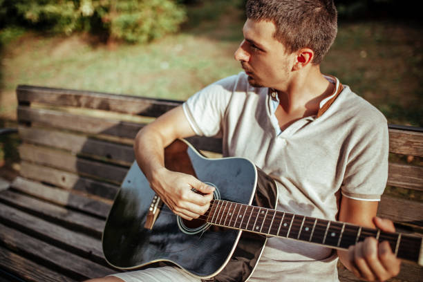 istock Musician playing acoustic guitar 1172966360
