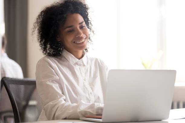 istock Happy black employee get pleasant message on laptop 1172966614