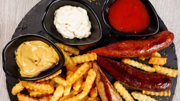 istock Delicious sausage served with fries 1172966858