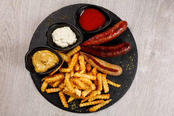 istock Delicious sausage served with fries 1172966898