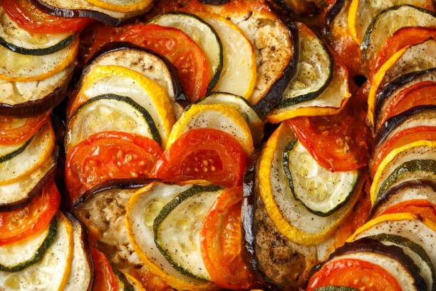 istock Ratatouille Vegetable Stew with zucchini, eggplants, tomatoes, garlic, onion and basil. Traditional French food. 1172969862
